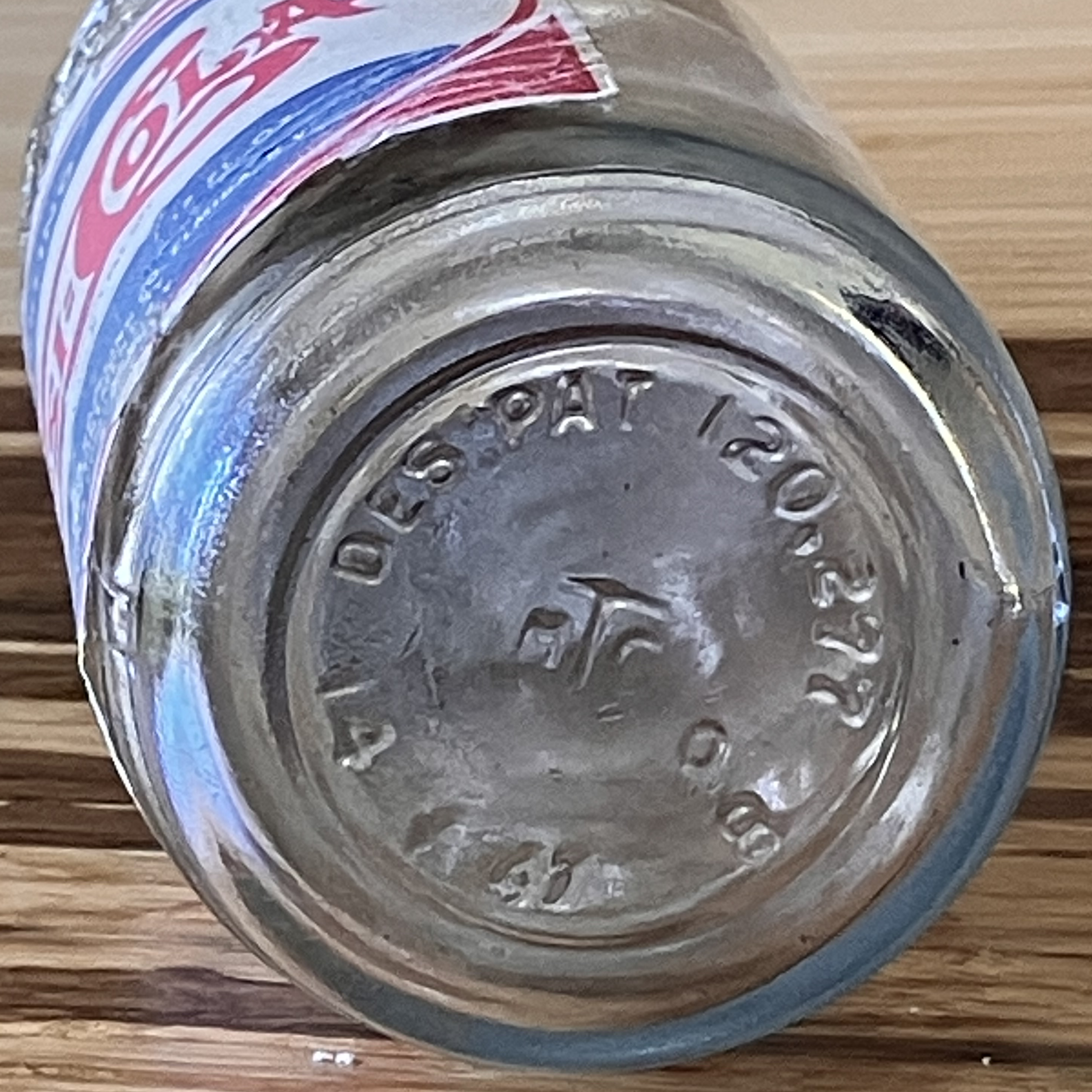 Bottom of glass bottle with identifying marks