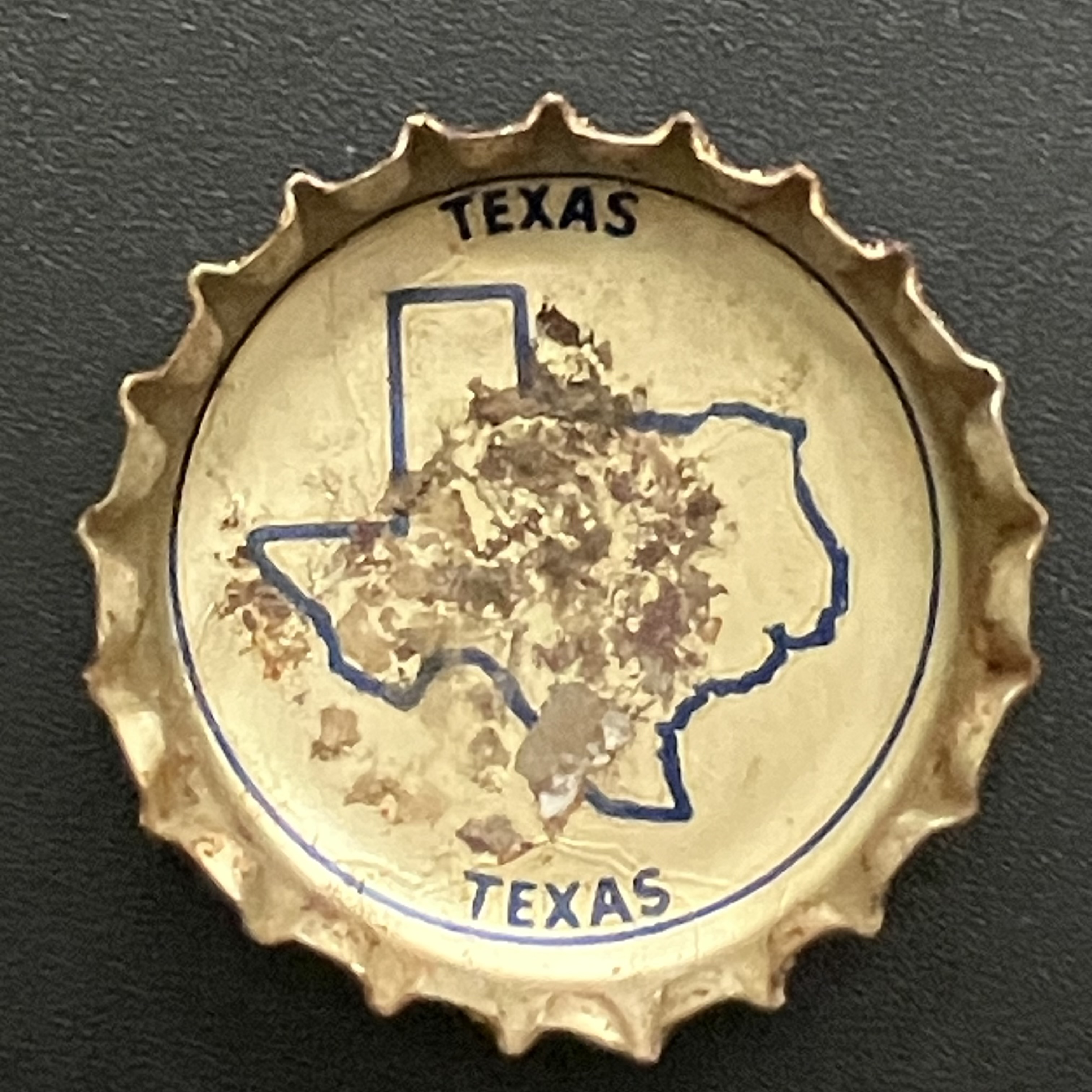 crown-cap liner of outlined map of Texas